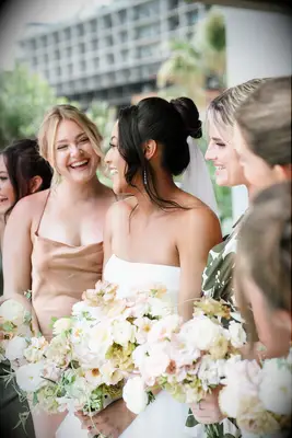 Voluminous bun with tendrils formal wedding hairstyle