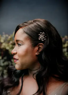 Soft curls and sparkling clip formal wedding hairstyle