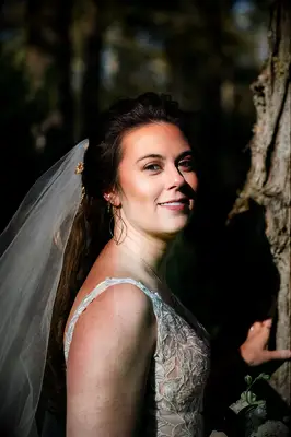 Half-up half-down formal wedding hairstyle with volume