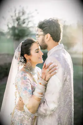 Soft bun with flowers formal wedding hairstyle