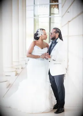 Low bun and statement accessory formal wedding hairstyle