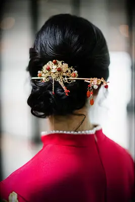 Embellished low bun formal wedding hairstyle