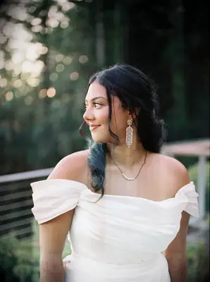 Half-up formal wedding hairstyle with soft curls