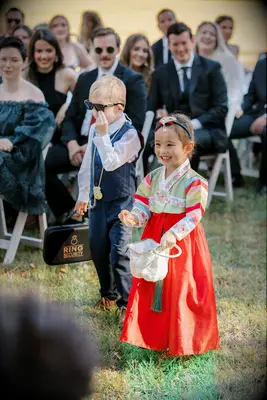 Flower girl at Korean wedding with traditional hair accessory