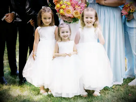 Half up flower girl hairstyle with two braids