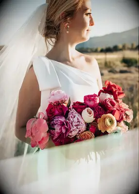 Knotted low bun wedding hairstyle with veil