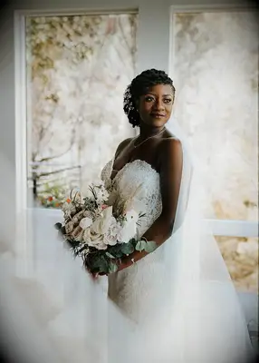 Side-swept updo with veil wedding hairstyle