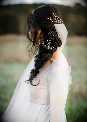 Long fishtail braid wedding hairstyle with veil