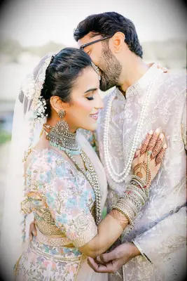 Voluminous bun wedding hairstyle with veil