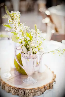 Tree stump with silver-wear used as centre piece