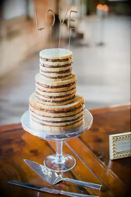 three tier vanilla naked wedding cake with chocolate filling and gold LOVE cake topper