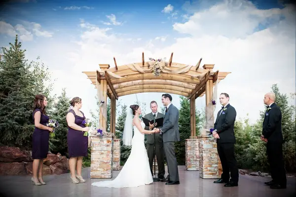 Rock and wooden wedding arbor
