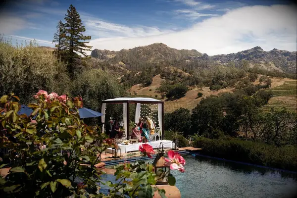 Lightly draped poolside arch