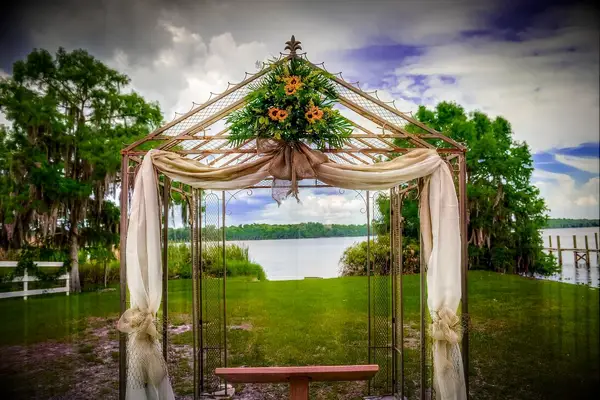 Golden wedding arbor with flowers
