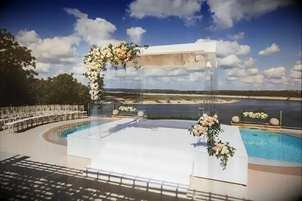 Modern wedding arch by pool