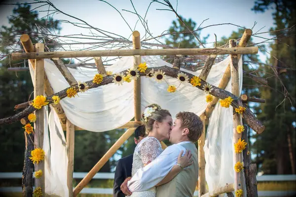 Sunflower adorned wooden arbor