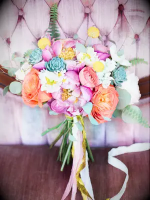 Bright wedding bouquet with peonies and ranunculus