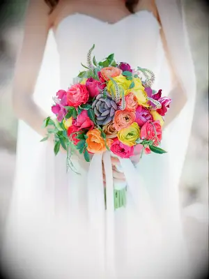 Bright wedding bouquet with succulents and ranunculus