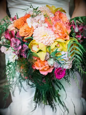 Bright bridal bouquet with dahlias, orchids, stock and alstroemeria