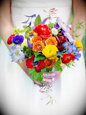 Bright bouquet with anemones, scabiosa and ranunculus