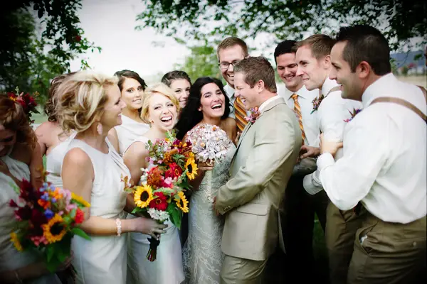 Bride and bridesmaids with contrasting sunflower bouquets
