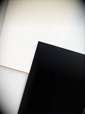 modern black and white vow books with blind embossing