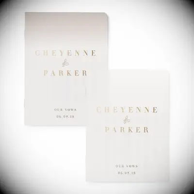 simple blush vow books with gold lettering 