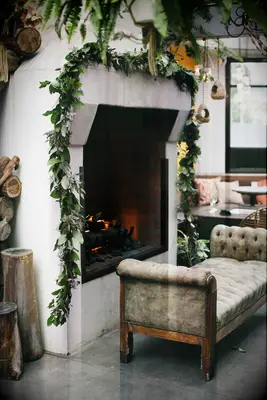 simple wedding fireplace decor idea with greenery garland