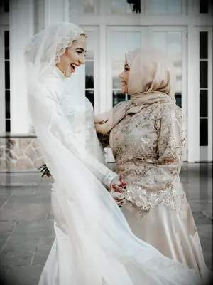 Bride with maid of honor on wedding day