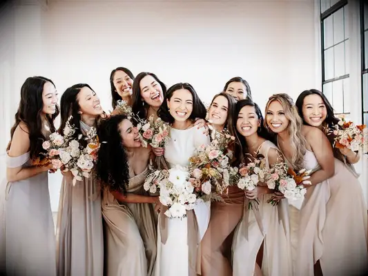 Bridesmaids posing with bride on wedding day
