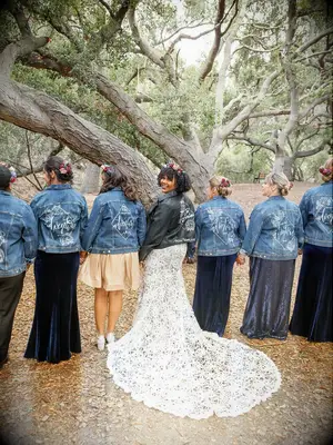 Bridesmaids wearing matching custom wedding denim jackts