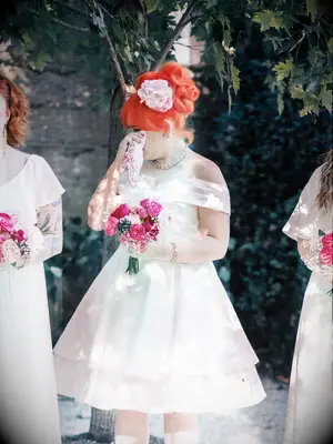 Bridesmaid tearing up at ceremony