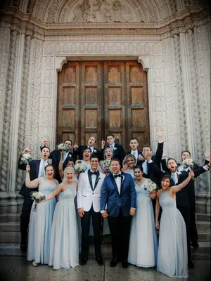 Grooms with wedding party outside ceremony site