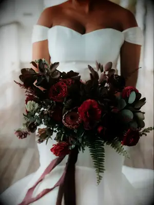 dark burgundy winter wedding bouquet with eucalyptus and ferns