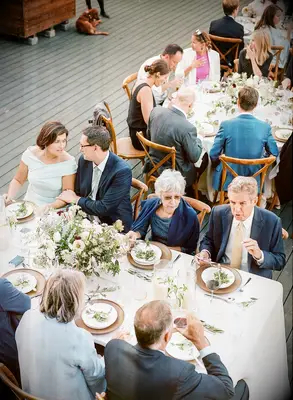 Overview of wedding guests at the outdoor reception