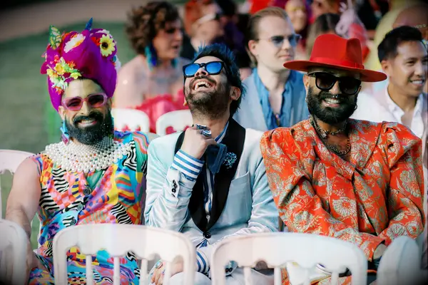 Happy wedding guests during outdoor ceremony