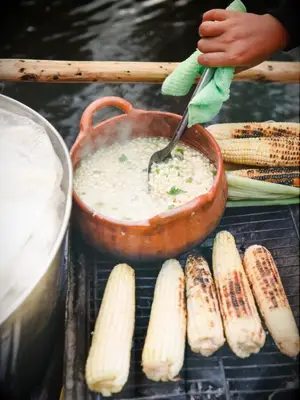 corn and soup on outdoor grill