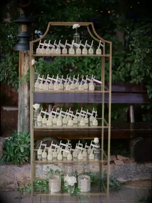 bookshelf with tequila escort cards