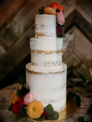 semi-naked cake with orange flowers