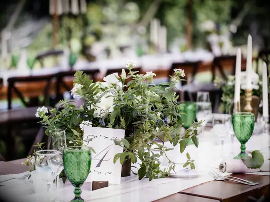 short wedding centerpiece with greenery vines