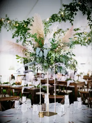 tall boho wedding centerpiece with eucalyptus and pampas grass