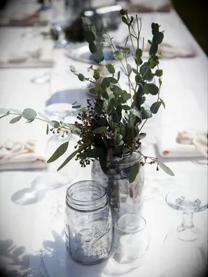 simple greenery wedding centerpiece with eucalyptus in mason jar