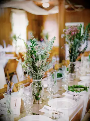 short eucalyptus wedding centerpiece in mason jar