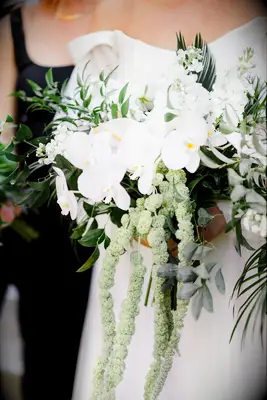 Elegant White Orchids With Cascading Greenery in Bridal Bouquet