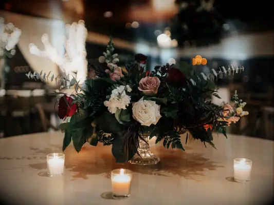 Winter-Inspired Centerpiece of Roses and Greenery