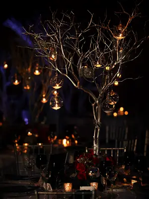 Tree Centerpiece Adorned With Ornament Candles