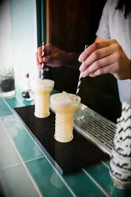 Frozen pina colada cocktail for signature wedding drink idea