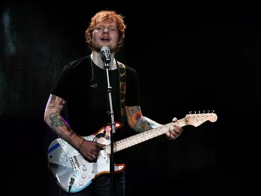 Ed Sheeran singing on stage