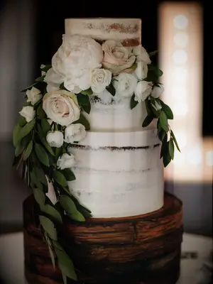 rustic fall wedding cake with buttercream icing, painted faux wood design and blush roses 