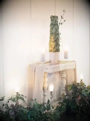 ornate fall wedding cake with sculpted fondant tiers and 3D sugar flower details in sage green color